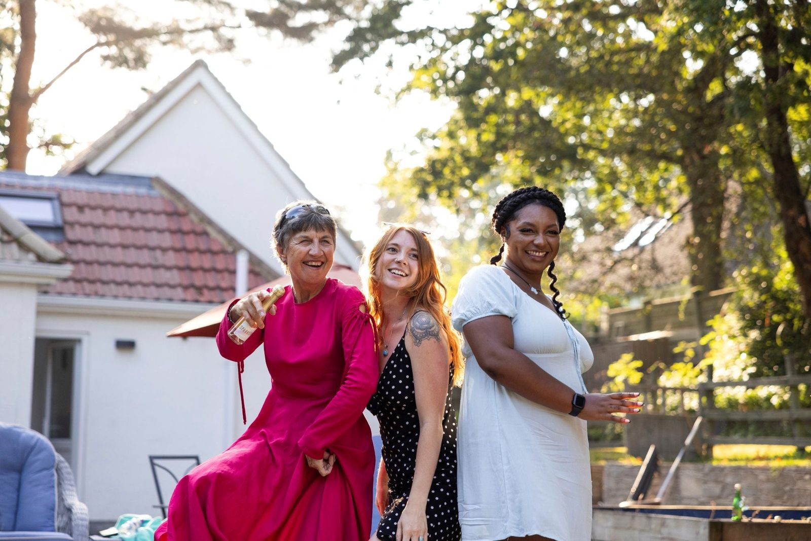 Friends laughing outdoors in summer